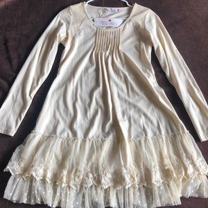 A light yellow, lace, long sleeve dress